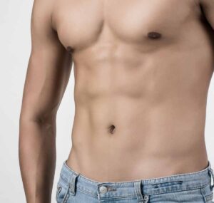 Enhanced muscle definition through male liposculpture.